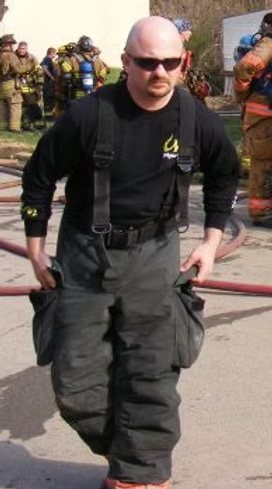 Mergl in turnout gear during his fire service years